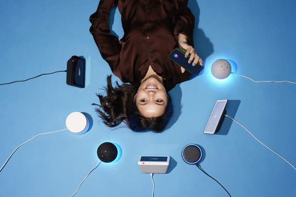 Sydney Pantini with several virtual assistant devices.