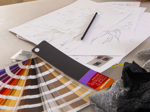 Color swatches and design sketches laying on desk